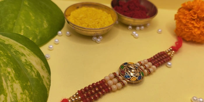Lord Ganesh Rakhi with a 3-Layer Thread and Roli - Chawal
